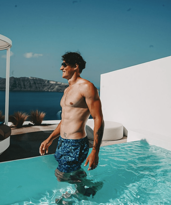 Yul posing for the transformation section, where he stands in a swimming pool.